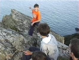 Tao points out the shipwreck on the opposite side of the estuary
